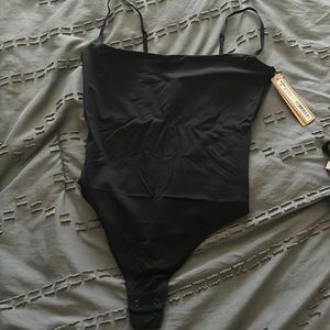BRAND NEW NEVER WORN TAGS ON SKIMS SIZE SMALL CAMI THONG BODYSUIT!! ONYX